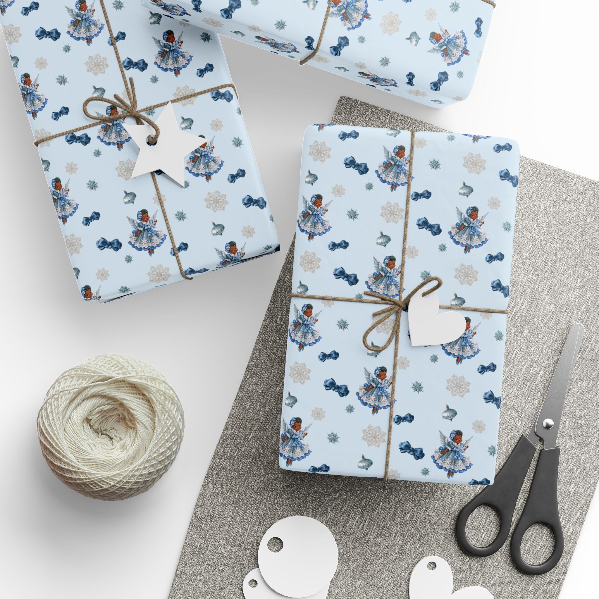 Christmas Wrapping Paper featuring blue angel artwork with soft winter holiday accents.
