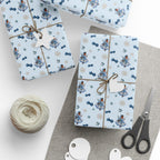 Christmas Wrapping Paper featuring blue angel artwork with soft winter holiday accents.