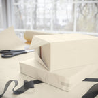 Christmas Wrapping Paper featuring solid cream gift wrap made to coordinate with holiday decorations.