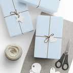 Christmas Wrapping Paper featuring solid winter blue gift wrap made to coordinate with holiday decorations.