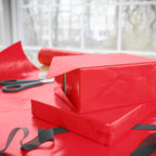 Christmas Wrapping Paper featuring solid cheer red gift wrap made to coordinate with holiday decorations.