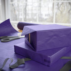 Christmas Wrapping Paper featuring solid nutcracker purple gift wrap made to coordinate with holiday decorations.