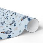 Christmas Wrapping Paper featuring blue angel artwork with soft winter holiday accents.