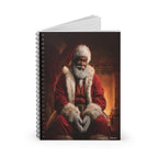 Christmas Spiral Notebook featuring Black Santa seated beside a glowing fireplace in a cozy Christmas scene.