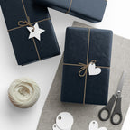 Christmas Wrapping Paper featuring blue angels, ornaments, bows and stars on a deep midnight background.