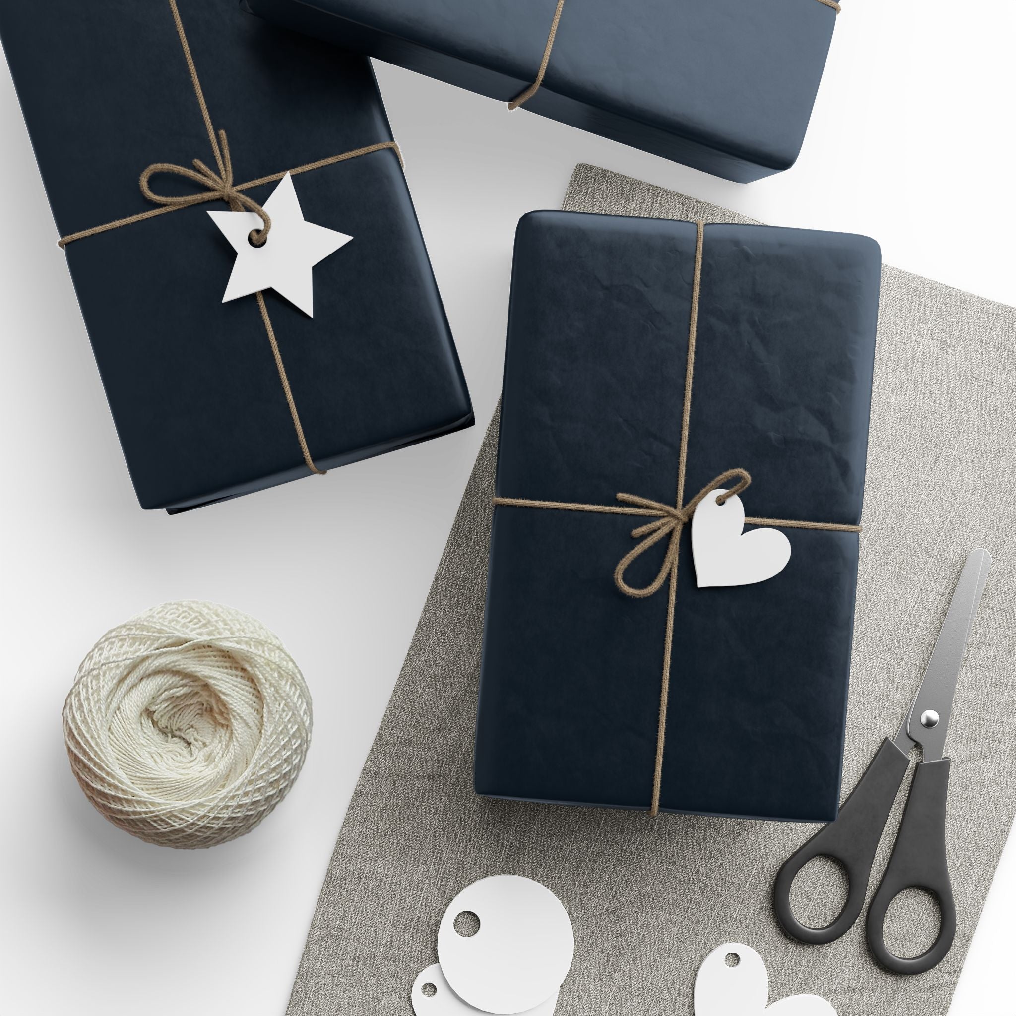 Christmas Wrapping Paper featuring blue angels, ornaments, bows and stars on a deep midnight background.
