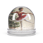 Christmas Snow Globe featuring a graceful young Black ballerina dancing beside a decorated Christmas tree.