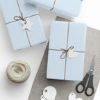 Christmas Wrapping Paper featuring solid winter blue gift wrap made to coordinate with holiday decorations.