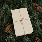 Christmas Wrapping Paper featuring solid cream gift wrap made to coordinate with holiday decorations.
