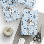 Christmas Wrapping Paper featuring blue angel artwork with soft winter holiday accents.