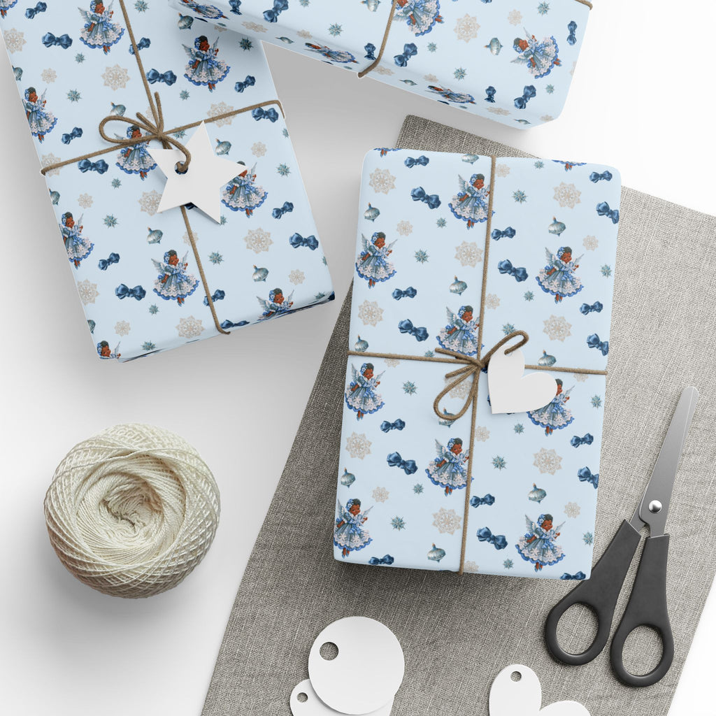 Christmas Wrapping Paper featuring blue angel artwork with soft winter holiday accents.