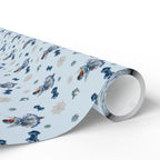 Christmas Wrapping Paper featuring blue angel artwork with soft winter holiday accents.