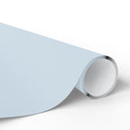 Christmas Wrapping Paper featuring solid winter blue gift wrap made to coordinate with holiday decorations.