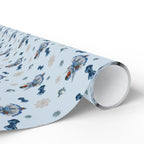 Christmas Wrapping Paper featuring blue angel artwork with soft winter holiday accents.